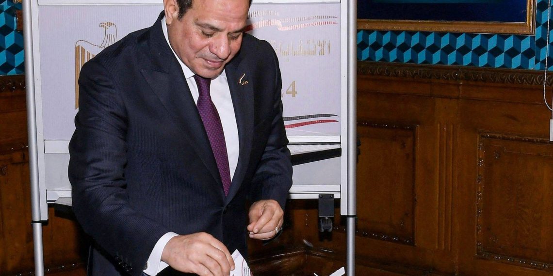 A handout picture released by the Egyptian Presidency on December 10, 2023, shows Egyptian president Abdel Fattah al-Sisi casting his vote in the presidential election at Mustafa Yousry Emmera School in Cairo. The vote in the country of nearly 106 million people will run until December 12, with results expected to be announced on December 18. (Photo by Handout / Egyptian Presidency / AFP) / XGTY / RESTRICTED TO EDITORIAL USE - MANDATORY CREDIT "AFP PHOTO / EGYPTIAN PRESIDENCY" - NO MARKETING NO ADVERTISING CAMPAIGNS - DISTRIBUTED AS A SERVICE TO CLIENTS