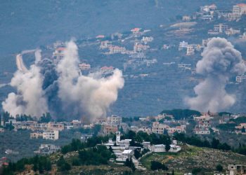 TOPSHOT - Smoke billows after Israeli bombardment over Lebanon's southern town of Kfar Kila near the border with Israel on December 21, 2023, amid ongoing cross-border tensions as fighting continues between Israel and Hamas militants in Gaza. (Photo by AFP)